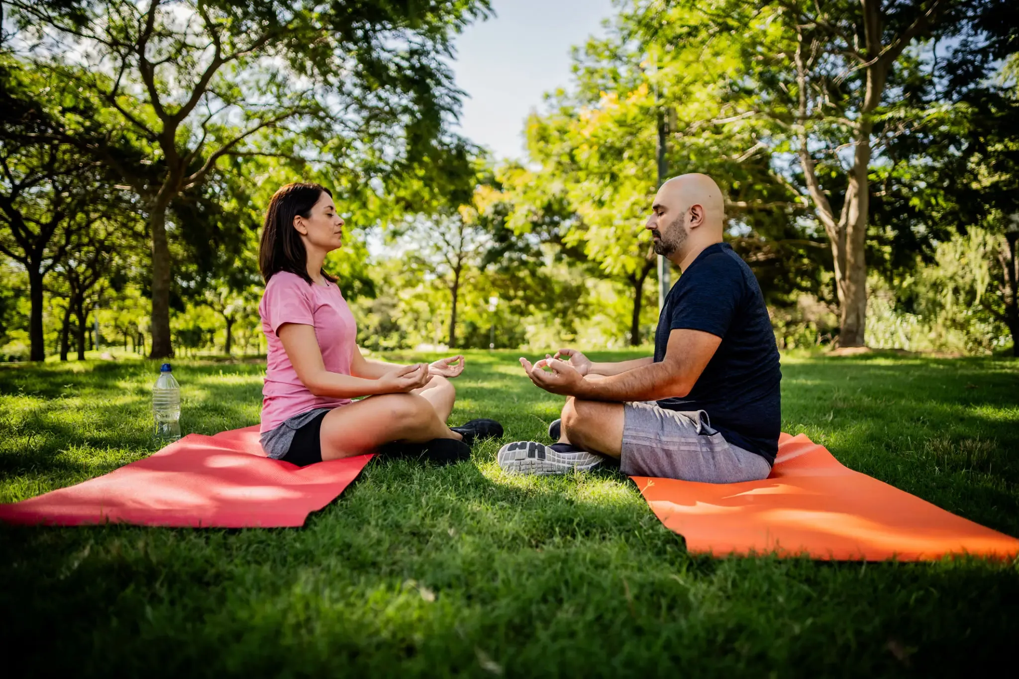 mid-adult-couple-meditating-in-a